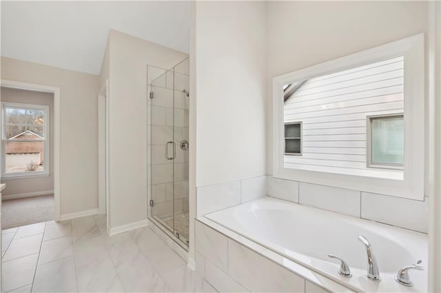 5997 Creek Indian Dr, Sugar Hill, GA 30518 - bathroom with a bath, a shower stall, and marble finish floors