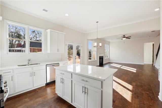 5997 Creek Indian Dr, Sugar Hill, GA 30518 - kitchen with dishwasher, healthy amount of natural light, white cabinets, decorative light fixtures, and recessed lighting