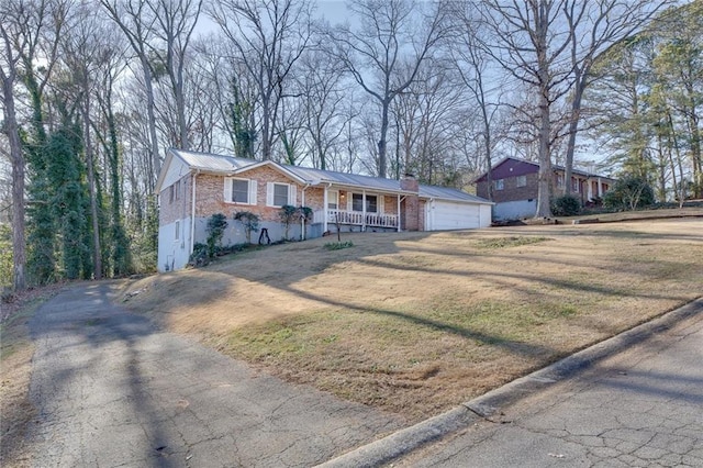 ranch-style house with a front lawn and a porch