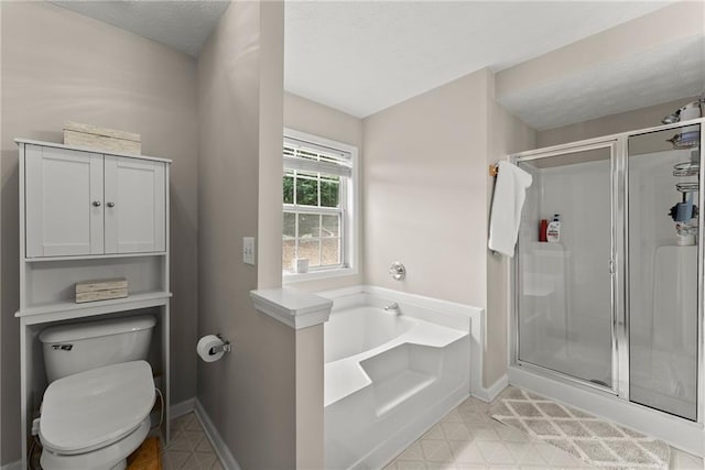 full bathroom with a garden tub, toilet, a stall shower, and a textured ceiling