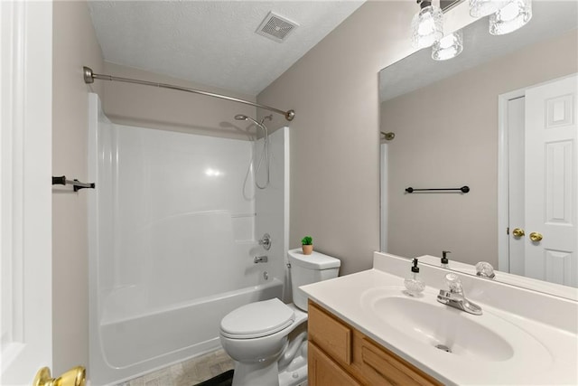 full bathroom with vanity, a textured ceiling, visible vents, shower / washtub combination, and toilet