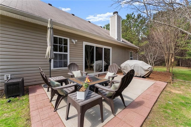 view of patio / terrace featuring area for grilling and an outdoor fire pit