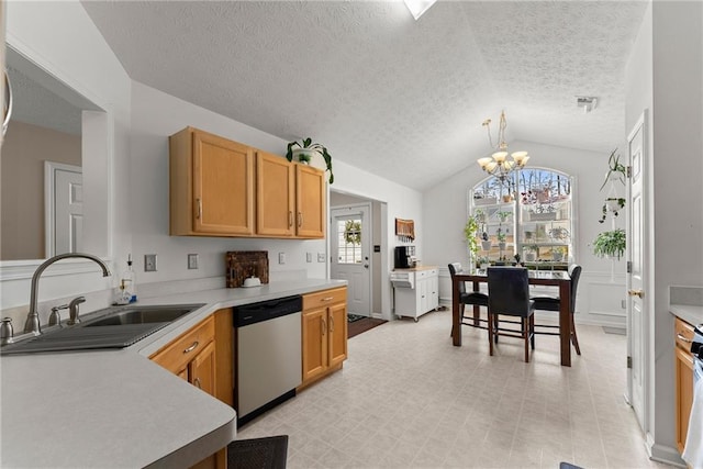 kitchen with a sink, vaulted ceiling, light countertops, dishwasher, and a chandelier