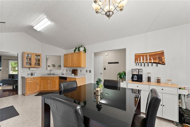 dining space with visible vents, a notable chandelier, a textured ceiling, light floors, and vaulted ceiling