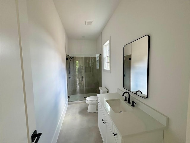 bathroom featuring toilet, a shower stall, vanity, finished concrete flooring, and baseboards
