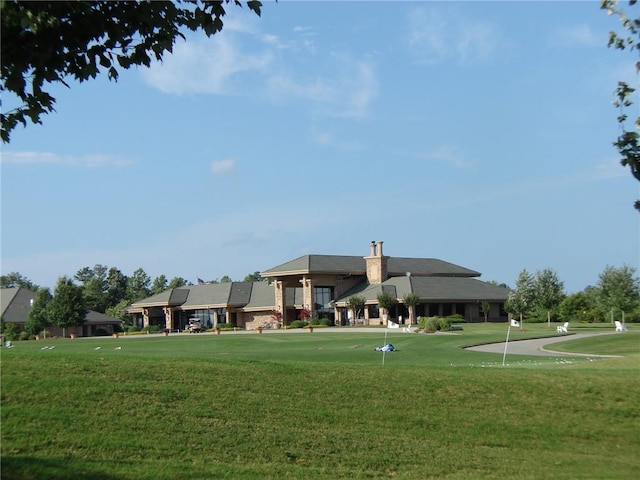 surrounding community with a putting area and a lawn