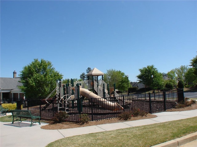 community jungle gym featuring fence