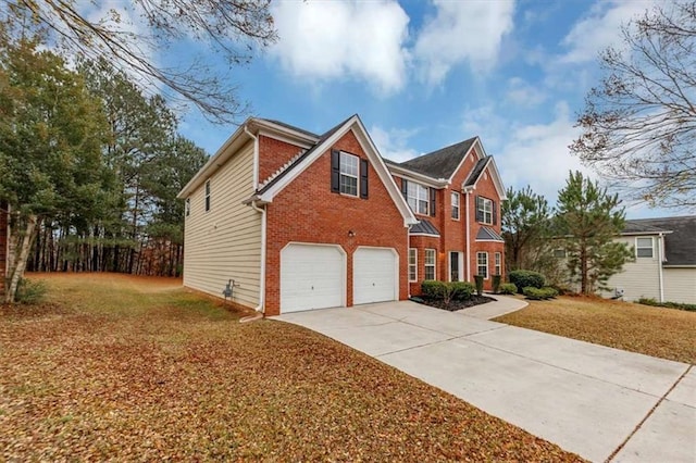 view of front of house featuring a front yard and a garage