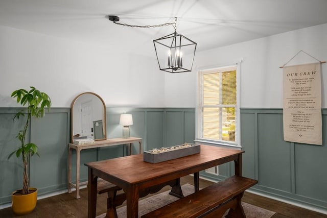 3142 Chamblee Gap Rd, Cumming, GA 30040 - dining space featuring dark wood-type flooring, a decorative wall, a chandelier, and wainscoting