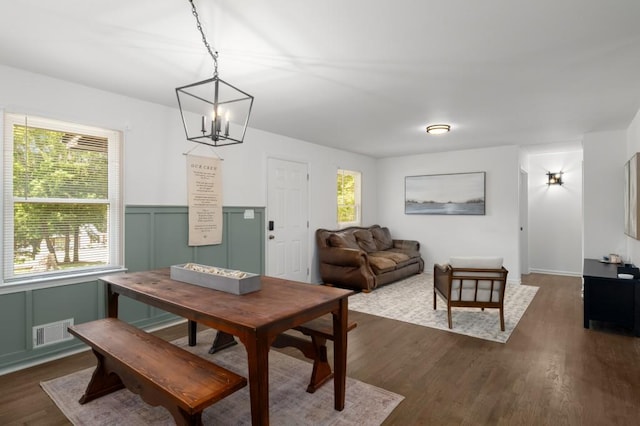 3142 Chamblee Gap Rd, Cumming, GA 30040 - dining area with a chandelier, dark wood-type flooring, plenty of natural light, and a wainscoted wall