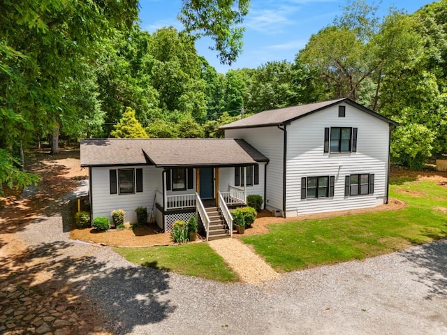3142 Chamblee Gap Rd, Cumming, GA 30040 - split level home featuring a porch, driveway, roof with shingles, and a front yard