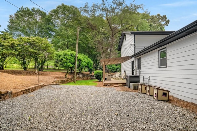3142 Chamblee Gap Rd, Cumming, GA 30040 - view of yard featuring cooling unit, a wooden deck, and a patio
