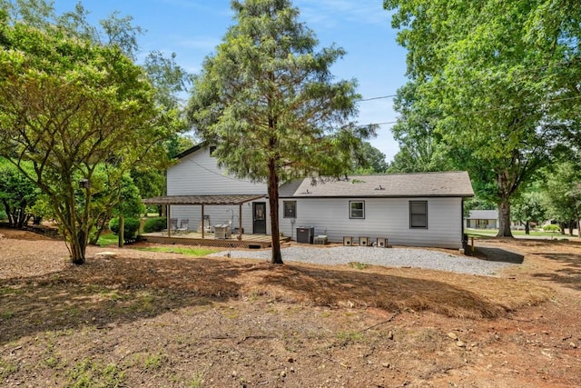 3142 Chamblee Gap Rd, Cumming, GA 30040 - back of property with a wooden deck and central AC unit