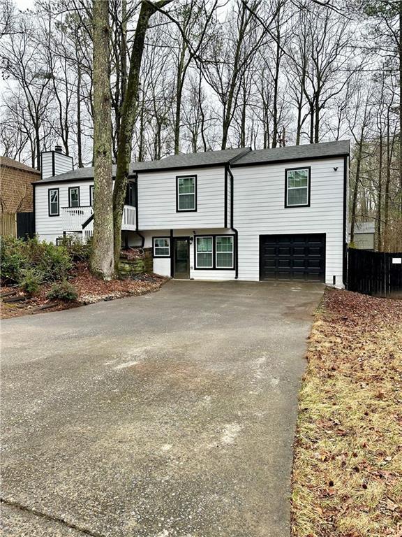 bi-level home featuring a garage