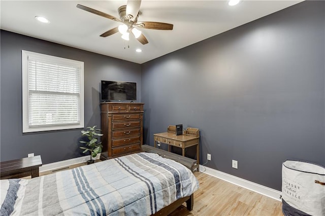 bedroom featuring ceiling fan and light hardwood / wood-style flooring