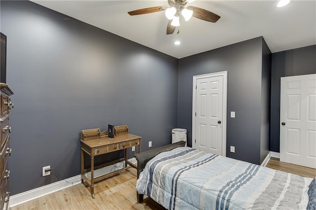 bedroom featuring ceiling fan and light hardwood / wood-style floors