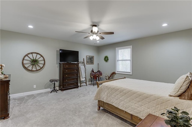 bedroom with light colored carpet and ceiling fan