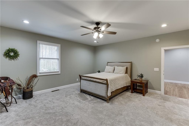 carpeted bedroom with ceiling fan