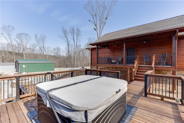 deck featuring a hot tub