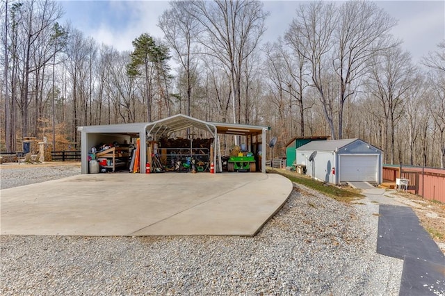 exterior space with an outbuilding, a garage, and a carport