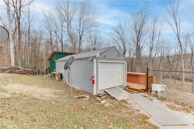 garage featuring a lawn