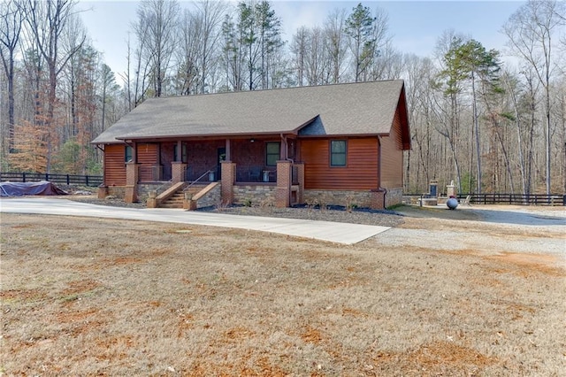 view of front of home featuring a front yard and a porch