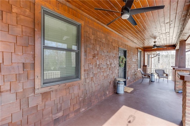 view of patio featuring ceiling fan and a porch