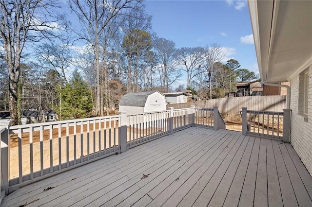 wooden terrace with a storage unit