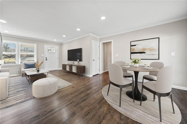 entrance foyer featuring dark wood-type flooring and ornamental molding