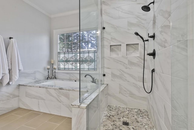 bathroom featuring crown molding, a garden tub, and tiled shower