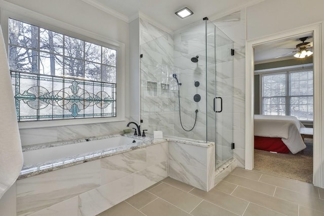 ensuite bathroom featuring plenty of natural light, a shower stall, crown molding, and a garden tub