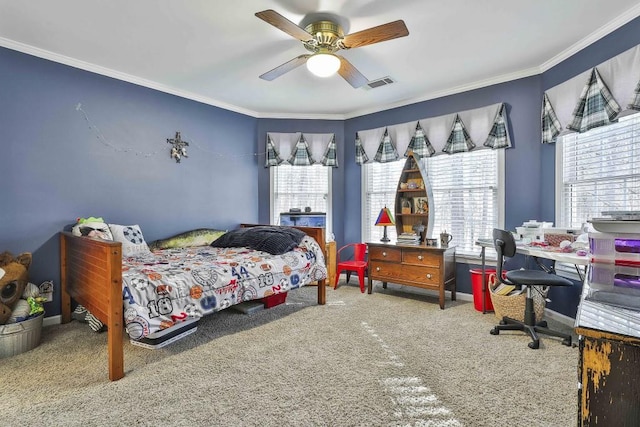 bedroom featuring carpet, baseboards, a ceiling fan, visible vents, and ornamental molding