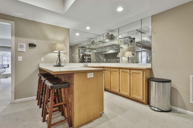 bar featuring recessed lighting, baseboards, and light colored carpet