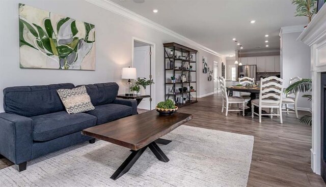 living room with ornamental molding and dark hardwood / wood-style floors