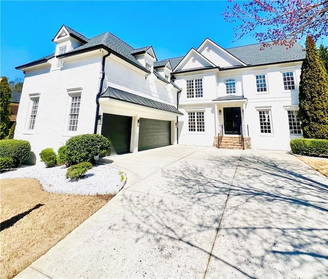 view of front of home featuring a garage and driveway