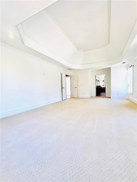 bathroom with tile patterned floors, toilet, crown molding, and separate shower and tub