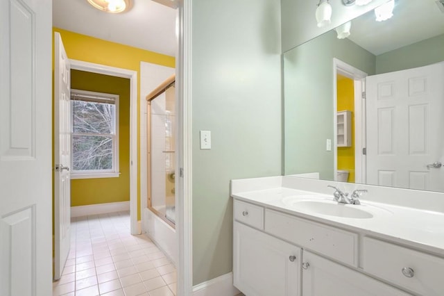 full bathroom featuring toilet, bath / shower combo with glass door, tile patterned floors, and vanity