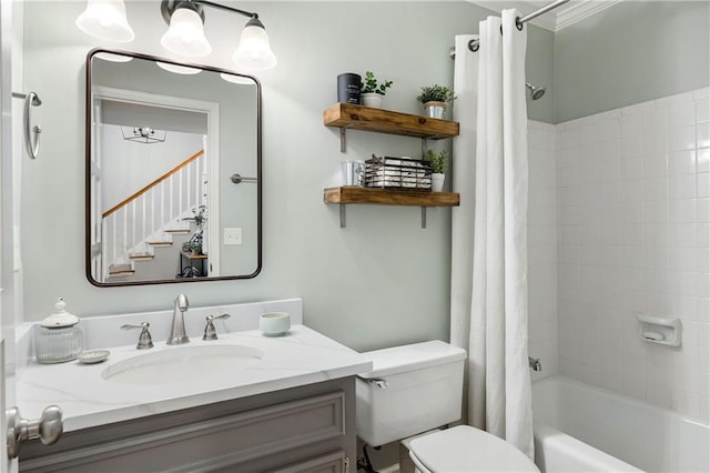 full bathroom featuring toilet, shower / tub combo with curtain, and vanity