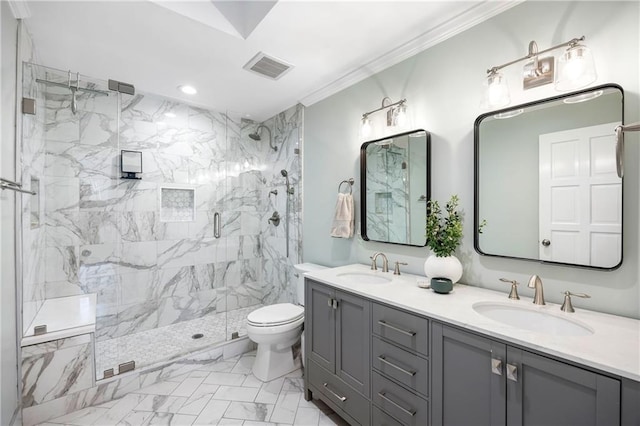 bathroom with a marble finish shower, visible vents, crown molding, toilet, and a sink