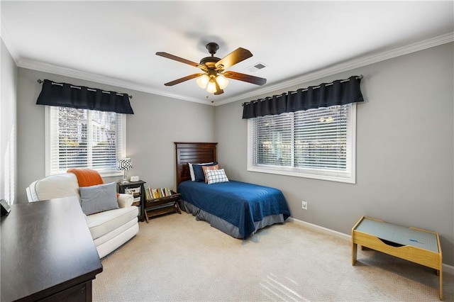 bedroom featuring baseboards, visible vents, carpet floors, ceiling fan, and crown molding