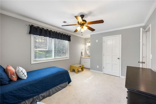 bedroom with ensuite bath, crown molding, light colored carpet, and baseboards