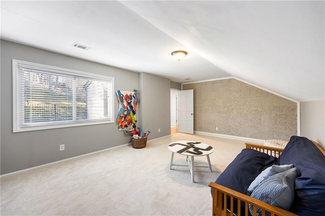 living area featuring visible vents, carpet flooring, baseboards, and lofted ceiling