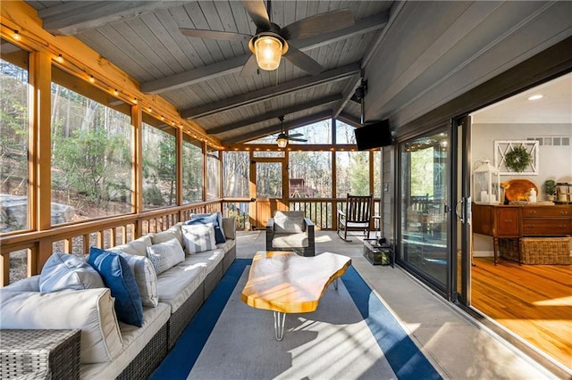 sunroom / solarium featuring vaulted ceiling with beams and ceiling fan