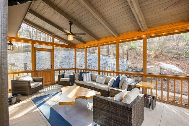 unfurnished sunroom with wood ceiling, vaulted ceiling with beams, and a ceiling fan