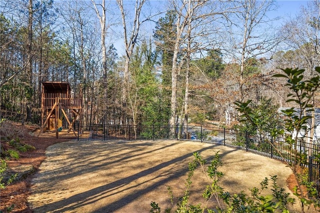 view of yard with a playground and fence