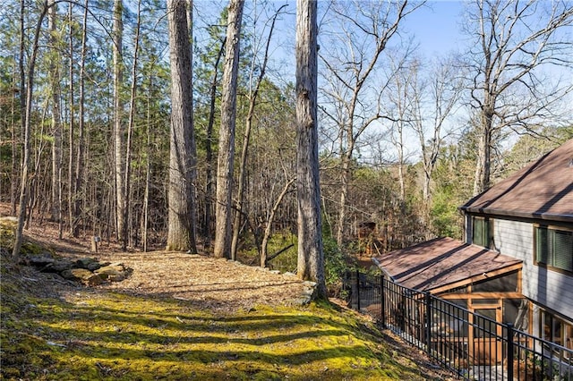 view of yard with a view of trees