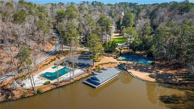 aerial view with a forest view and a water view