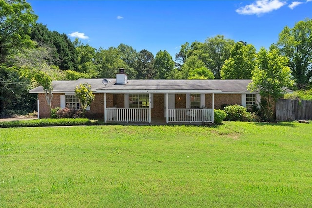 315 Pleasant Grove Rd, Mcdonough, GA 30252 - view of front of house featuring a porch, brick siding, and a chimney