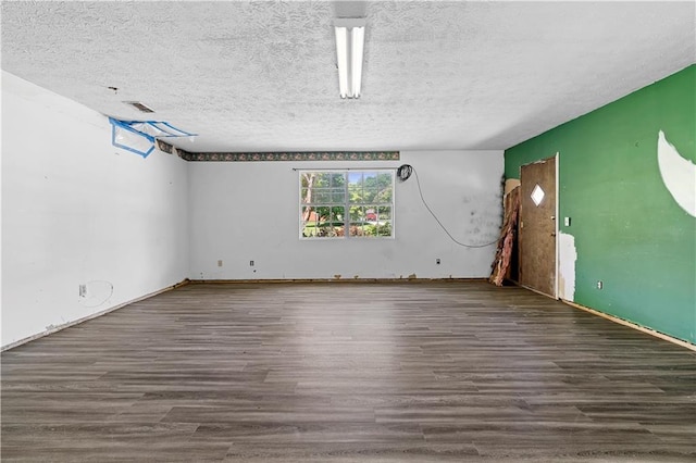 315 Pleasant Grove Rd, Mcdonough, GA 30252 - empty room featuring wood finished floors and a textured ceiling