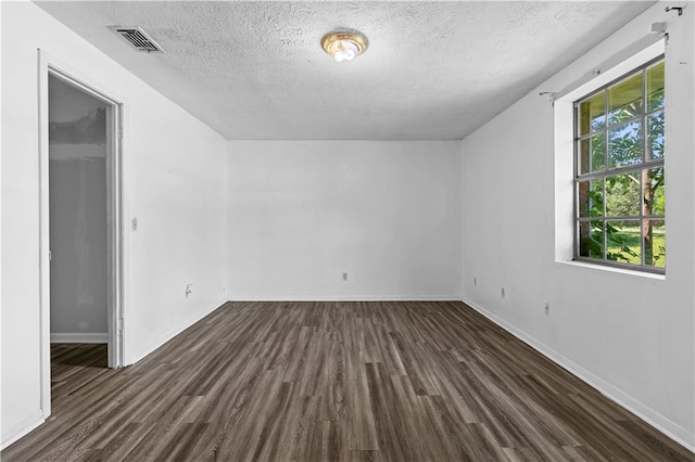 315 Pleasant Grove Rd, Mcdonough, GA 30252 - bonus room featuring dark wood-style flooring, a textured ceiling, and baseboards